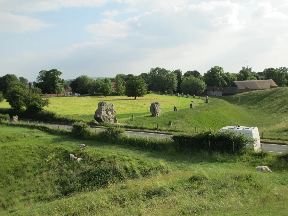 Standing stones of Avebury with the village behind, on the Avebury day of the Stonehenge tours from London, Wiltshire