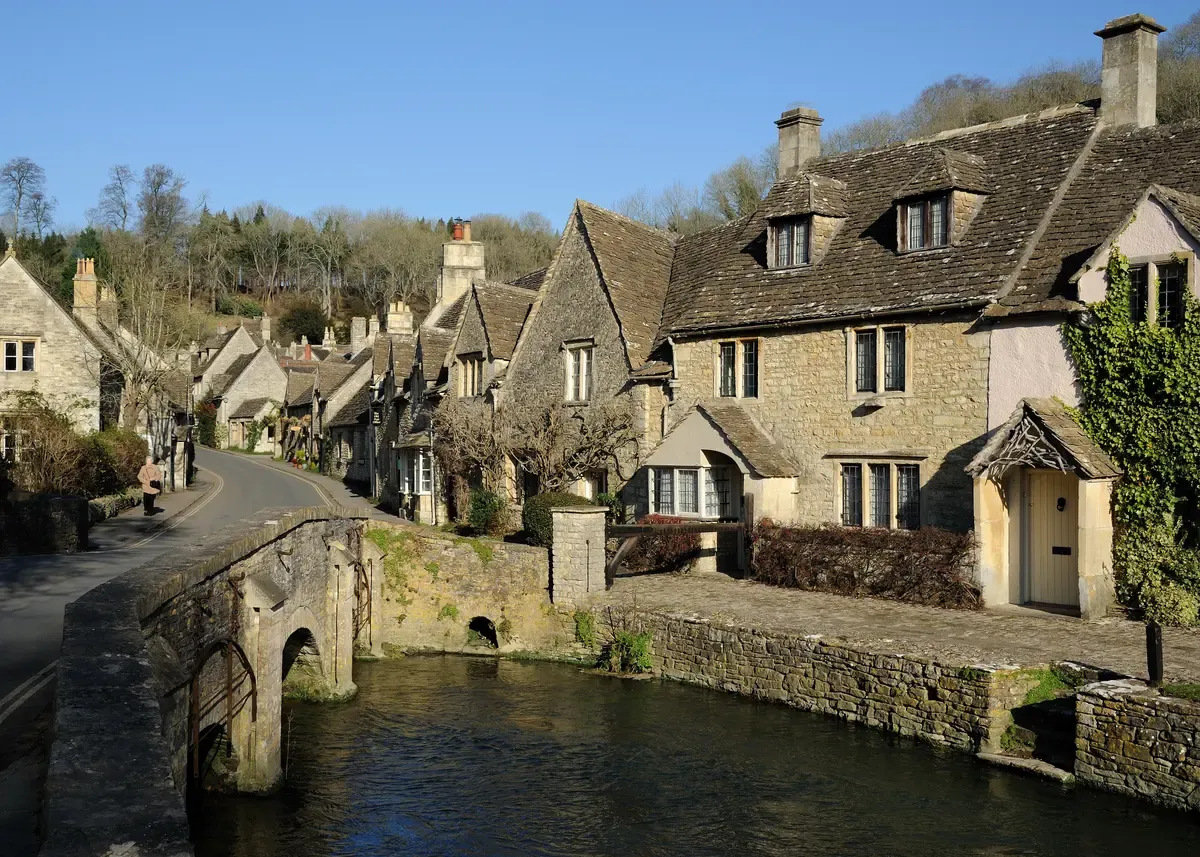 The packhorse bridge and cottages at Castle Combe, on a Stonehenge and Cotswolds tour from London, Wiltshire