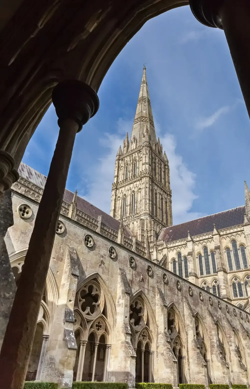 Salisbury Cathedral spire through the cloister arch, near Stonehenge on the train route from London, Wiltshire