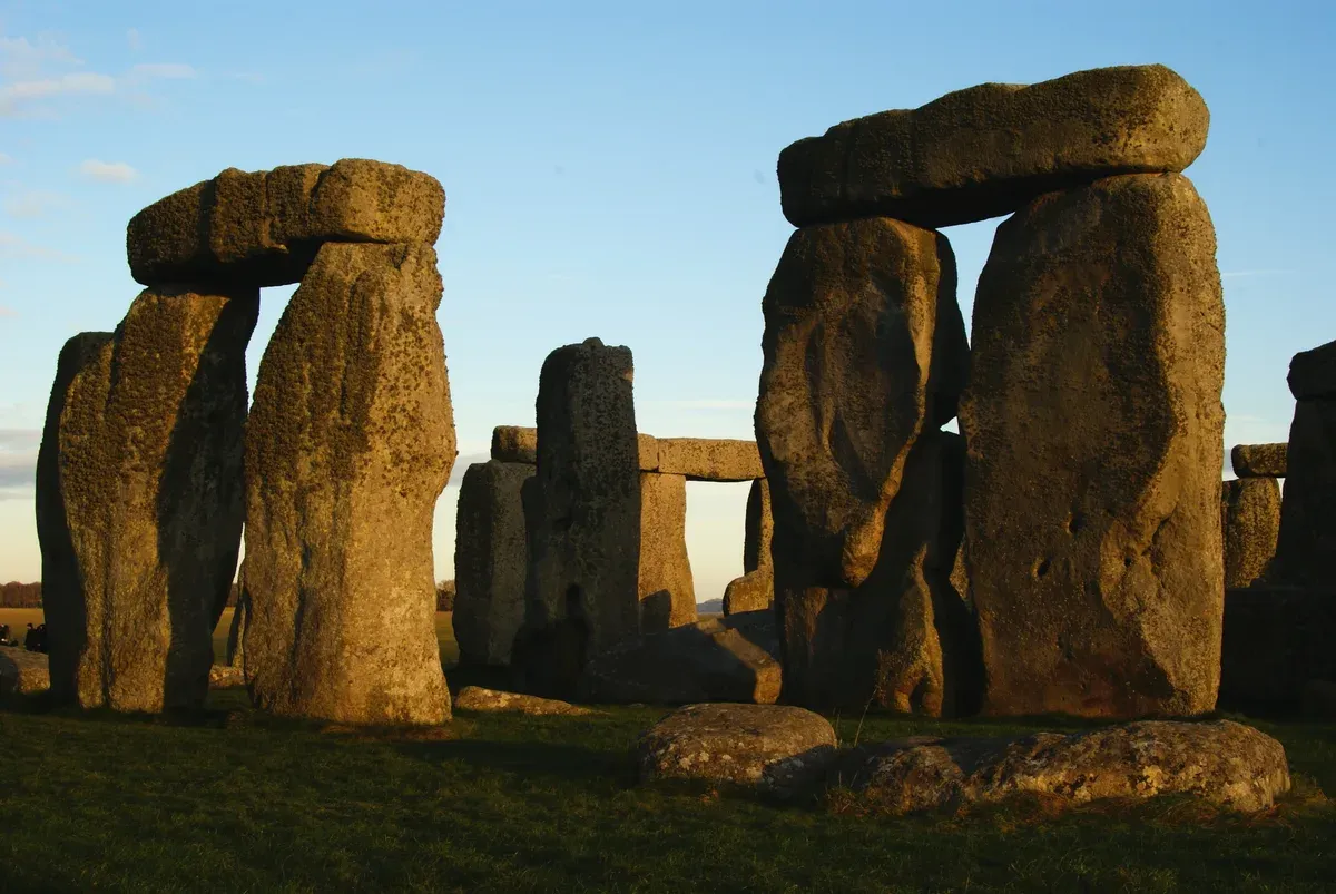 Sarsen trilithons at Stonehenge in low winter sun, seen on a Stonehenge tour from London, Wiltshire